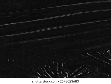 Black transparent plastic wrap texture overlay background. Realistic plastic for poster design and photo overlay effect. Wrinkled paper surface pattern for graphic design sources and element mockup.