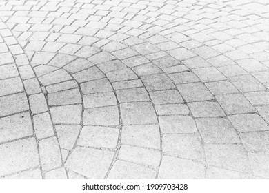 Black and white drawing of paving stones on the pavement.
