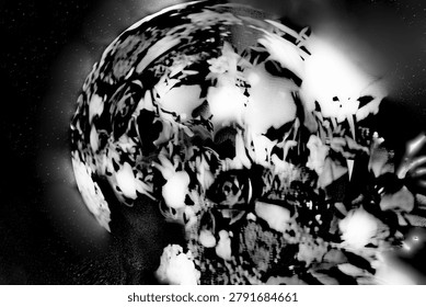 Black and white photograph of an exploding planet. Abstract composition with intense white light and stars in the background.