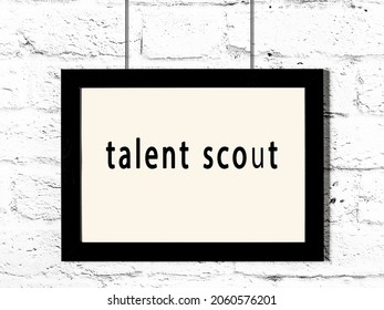 Black Wooden Frame With Inscription Talent Scout Hanging On White Brick Wall 