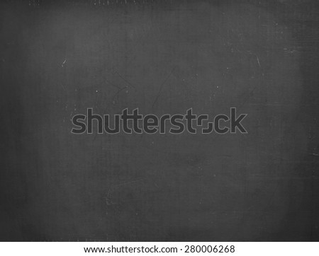 Blackboard / chalkboard texture. Empty blank black chalkboard with chalk traces