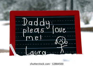 Blackboard has message from little girl begging her daddy to love her.  Red wooden frame with chalk. - Powered by Shutterstock