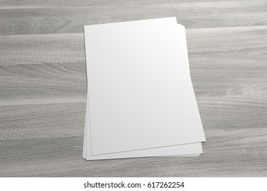 Blank 3D Illustration Stack Of Flyer Or Leaflet On Wooden Background