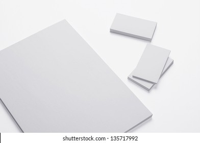 Blank A4 Print Paper And Business Cards Isolated On White Background With Soft Shadows / Stationary