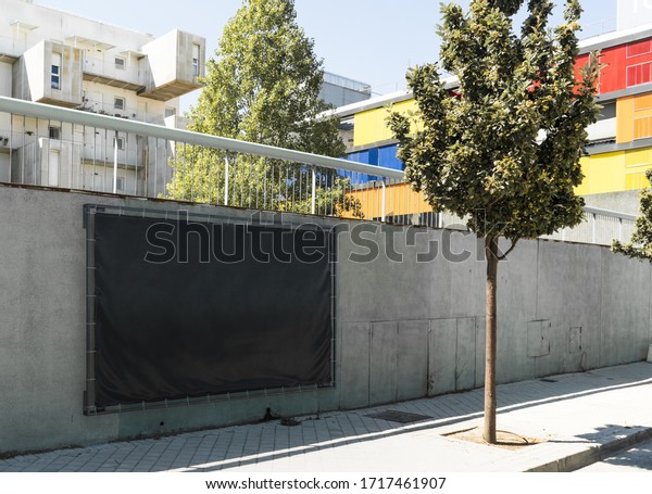 Blank Black\
Outdoor Horizontal Vinyl Textile Banner at Concrete Wall of\
Underground Car Parking. 3d\
rendering.
