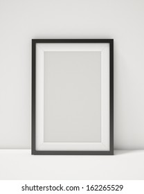 Blank Black Picture Frame On The White Interior Background