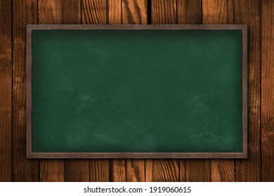 Blank blackboard on wooden wall