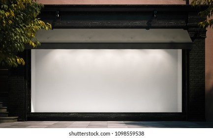 Blank empty shop window in the night street with light on the frame. 3d rendering