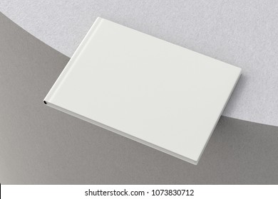 Blank Horizontal Book On The Edge. Isolated With Clipping Path Around Book. 3d Render