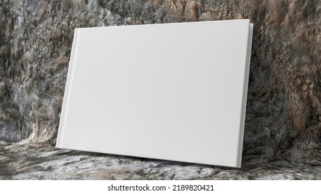 Blank Horizontal Hardcover Book Cover Mockup Standing On Stone Background. 3d Render