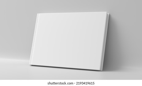 Blank Horizontal Hardcover Book Cover Mockup Standing On White Background. 3d Render