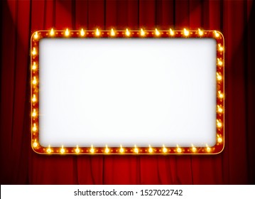 Blank light sign frame on red theatre curtain