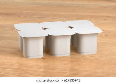 Blank Pack Of Six White Yogurt  Packaging. Mockup Dessert Plastic Container Isolated On Wooden Background With Clipping Path. 3d Render