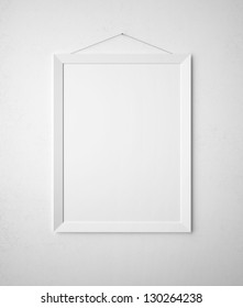 Blank Paper Frame On White Wall