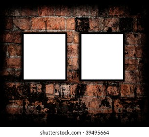 Blank photo frames on brick wall