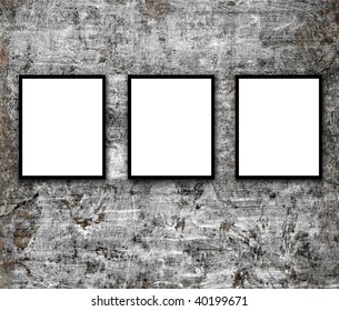 Blank photo frames on cement wall