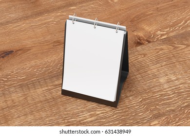 Blank Portrait Table Top Flip Chart Easel Binder Or Calendar Mockup Standing On Wooden Background. 3d Illustration