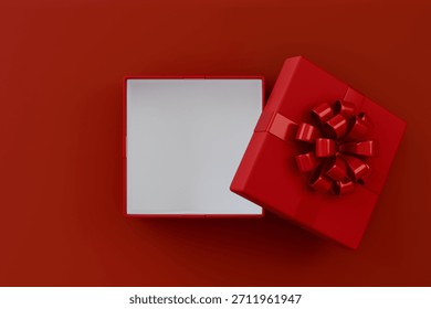 Blank red rectangle gift box mock up open or top view of white present box product display showcase frame tied with red ribbon bow resting on a vibrant red background.