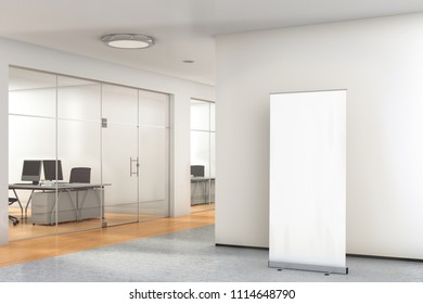 Blank Roll Up Banner Stand In Modern Office With Clipping Path Around Banner. 3d Illustration