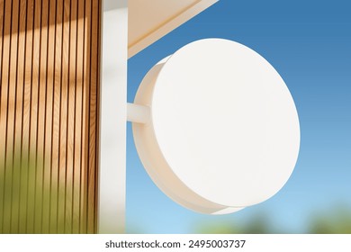 Blank round signboard attached to a modern wooden facade against a clear blue sky. Concept of advertising and business promotion. 3D Rendering. - Powered by Shutterstock