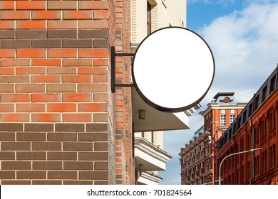 Blank Shop Sign Om Brick Wall. Round Signage Mockup. 3d Illustration.