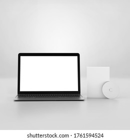 Blank software box with disk Mockup and notebook, medium size white Cardboard packaging box with cd and laptop, 3d rendering isolated on light background