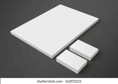 Blank Stationery on dark background with soft shadows. Consist of Business cards and A4 letterheads.