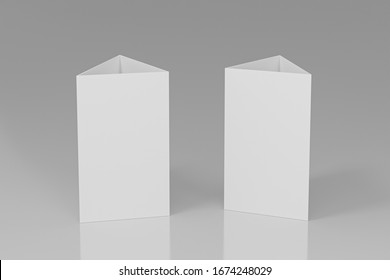 Blank Table Talker Isolated On White Background, Mockup Template Paper Tri-fold Vertical Triangle Cards With Reflections. White Sheets Front & Left And Right View. 3d Render