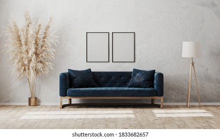 Blank vertical frames on gray decorative plaster wall in modern  living room interior with dark blue sofa, floor lamp, 3d rendering