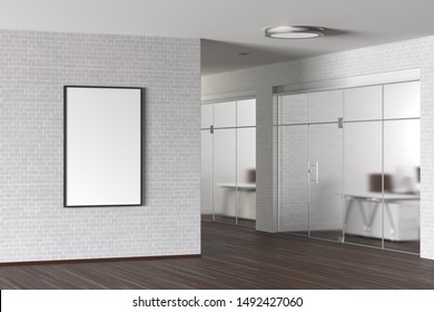 Blank Vertical Poster On The White Brick Wall In Modern Office. 3d Illustration