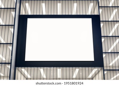 Blank White Billboard In Black Frame On Modern Building Wall. 3D Rendering, Mockup