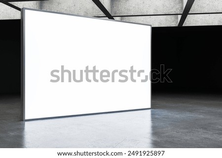 Blank white digital screen mockup in a dark exhibition room with concrete walls and a reflective floor. Concept of display design template, indoor advertising stand. 3D Rendering.