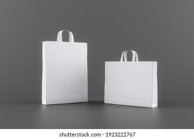 Blank white eco paper bags with a space for your logo at dark background. Mockup. 3D rendering