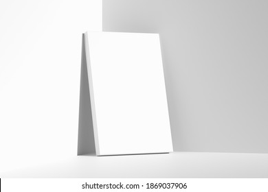 Blank white empty rectangular poster on floor leaning at empty white walls in cornet diagonal view, white bleached colorless poster mock-up, 3D Illustration