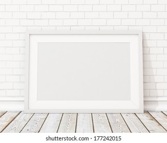 Blank White Horizontal Picture Frame On The White Brick Wall And The Vintage Floor