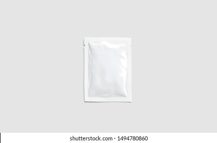 Blank white sachet packet mockup, isolated on gray background, 3d rendering. Empty disposable shampoo or conditioner pack mock up, top view. Clear sealed medication paket template.
