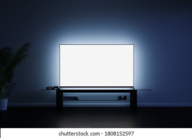 Blank White TV Screen On The Background Of The Wall Of The Apartment At Night. Television Advertising Concept. Mock Up. 3d Rendering