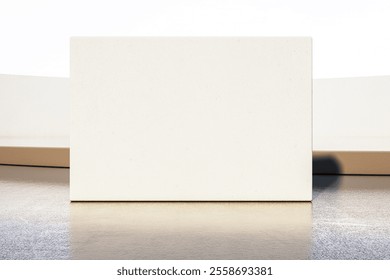 Blank white wall panel, minimalistic design, on a clean concrete floor in an outdoor space. Concept of branding, signage, and exhibition. 3D Rendering. - Powered by Shutterstock