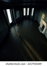 Blonde Woman In Sweatshirt Dress Walks In An Empty Classical Room With Fireplace. High Angle View. 3D Render.