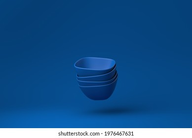 Blue bowls floating in blue background. minimal concept idea creative. monochrome. 3D render.