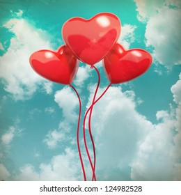 The blue cloudy sky with balloons, as valentines background