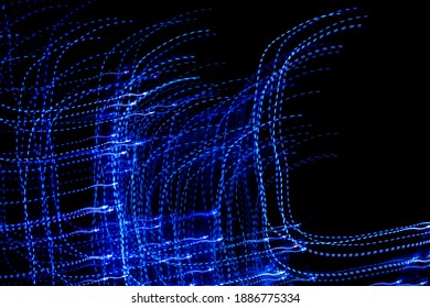 blue dashed lines of lights on a black background