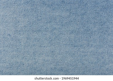 Blue frazzle jeans fabric. Concept of textured background