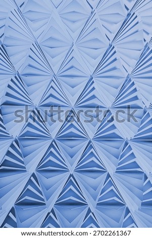 Blue geometric pattern of triangles as full frame and background