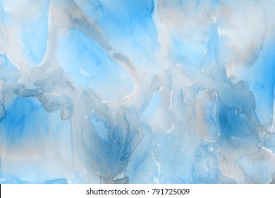 Blue with gray and white realistic watercolor texture on paper background.