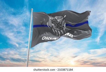 Blue Line Flag Of Oklahoma State, Usa At Cloudy Sky Background On Sunset, Panoramic View. United States Of America Police Flag. Copy Space For Wide Banner. 3d Illustration