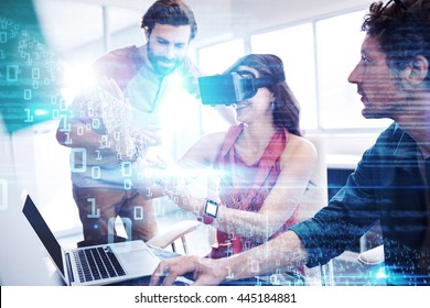 Blue and red technology interface against colleagues using technology