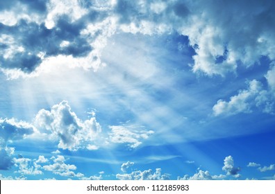 Blue Sky With Clouds And Sun.