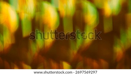 Blur prism light. Reflection ray. Gradient bokeh colorful sparks. Kaleidoscopic yellow green luminosity abstract defocused background.