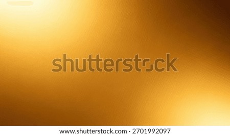 A blurred abstract background with a golden texture, featuring soft light and shadow gradients for a warm and luxurious feel.